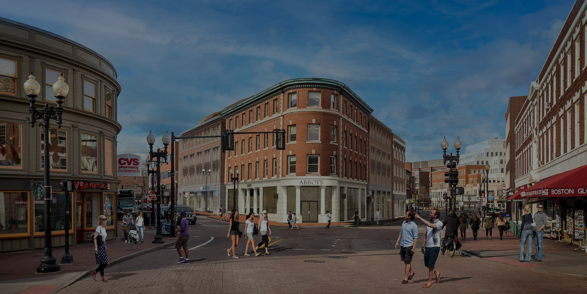 Aerial view of a rendered version of The Abbot brick building in Harvard Square, with pedestrians walking throughout the street and a dark overlay